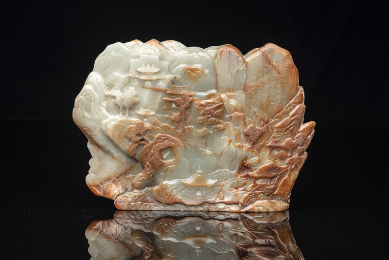 <b>A FINE CARVED GREEN AND RUSSET JADE BOULDER WITH A QIANLONG POEM</b>