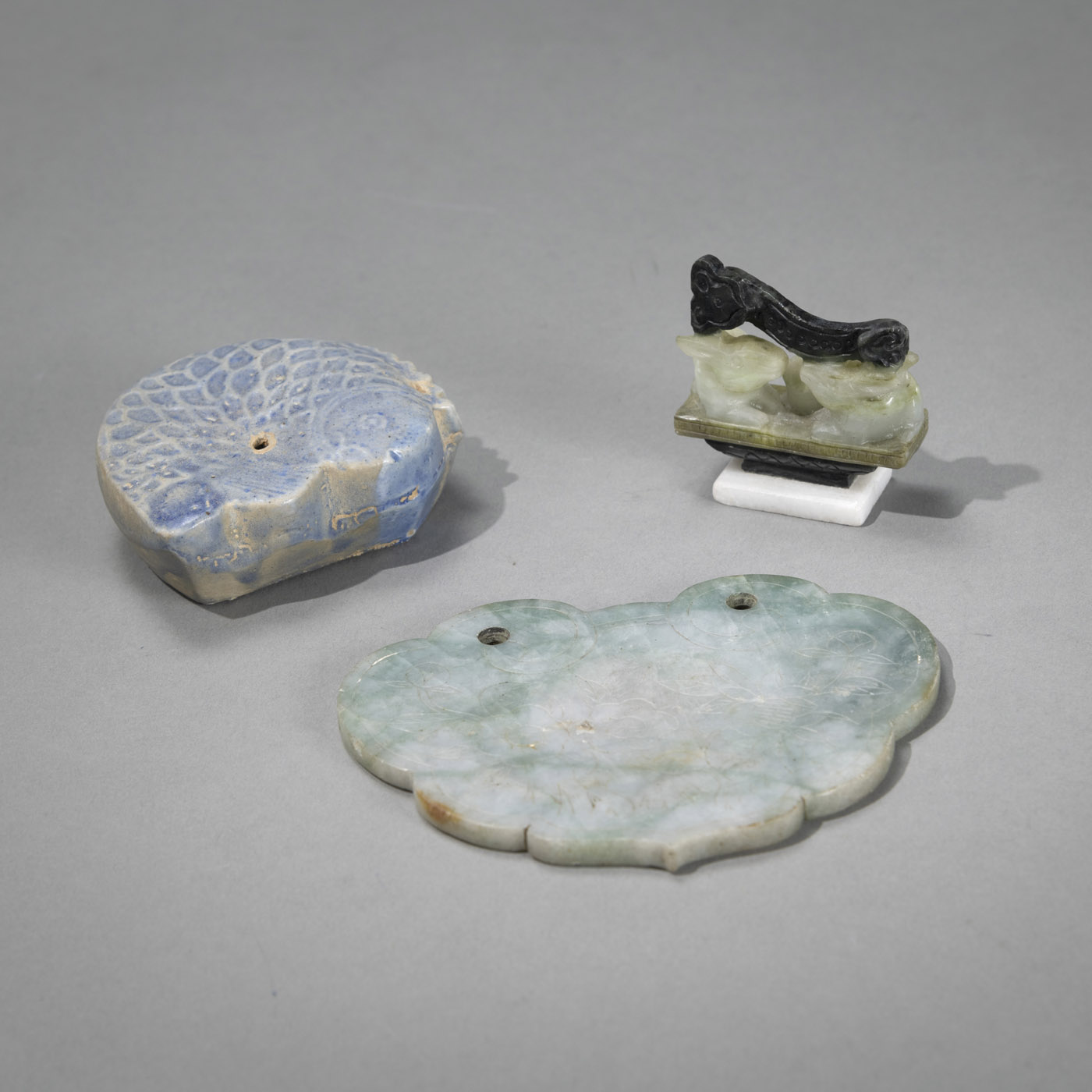 <b>A JADE RUYI PENDANT, A SOAPSTONE BRUSH REST AND A CERAMIC WATER DROPPER IN THE SHAPE OF A CARP</b>