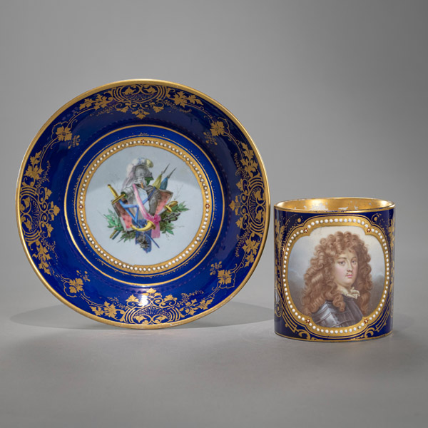 <b>A LARGE FRENCH CUP AND SAUCER WITH PORTRAIT OF LOUIS XIV</b>