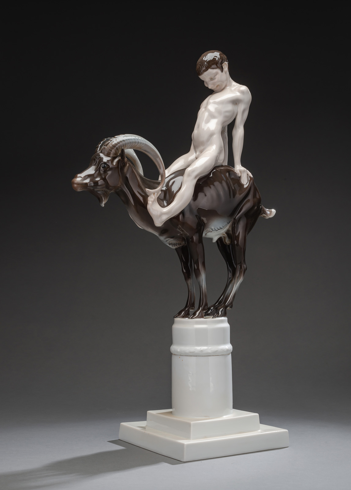 <b>A ROSENTHAL PORCELAIN GROUP OF A YOUNG FAUN ON A CAPRICORN</b>