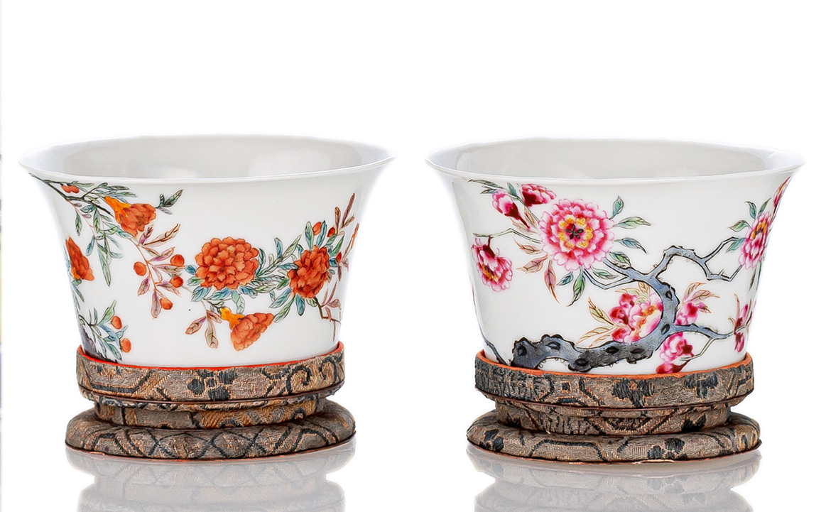 <b>A PAIR OF FINE FAMILLE ROSE FLOWER AND POEM CUPS ON SILK STANDS</b>