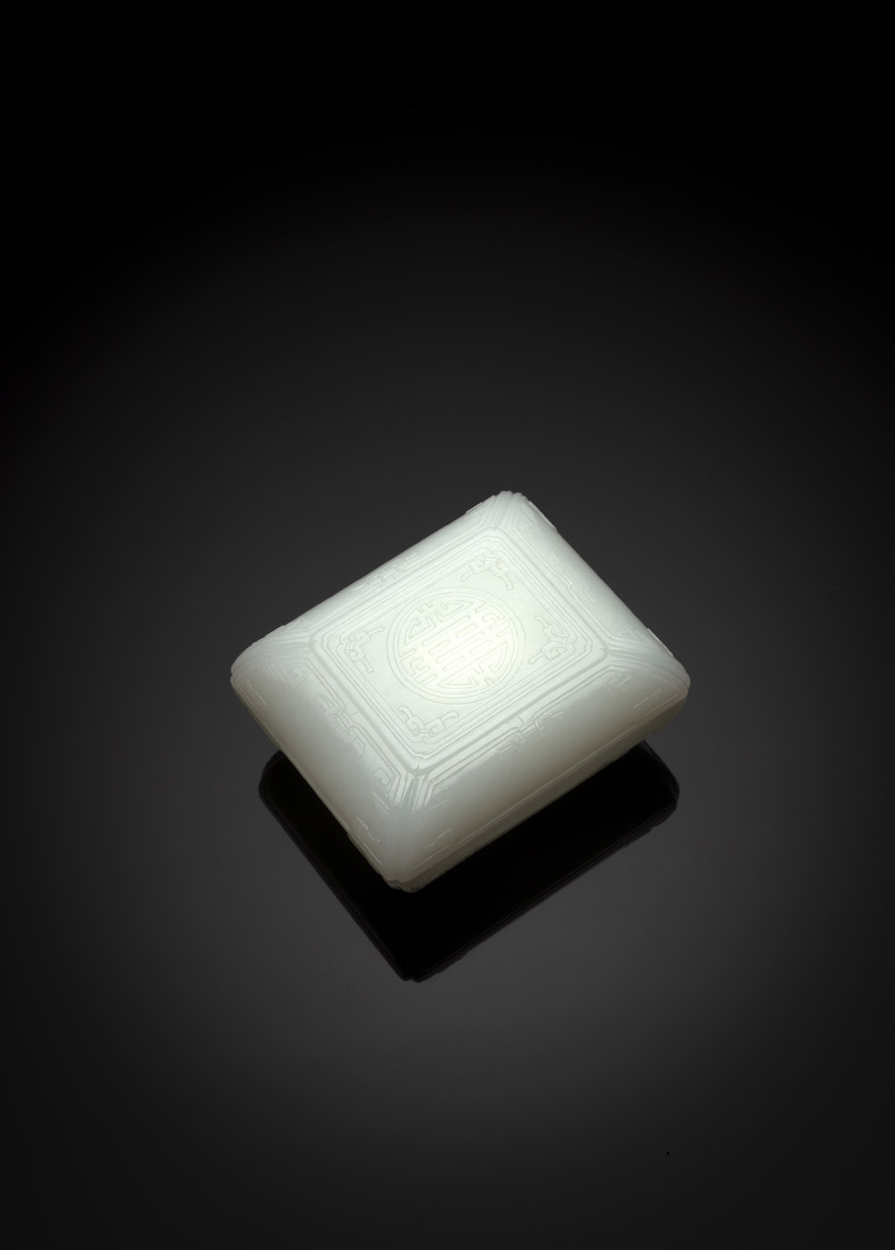 <b>A WELL CARVED NEAR WHITE RECTANGULAR JADE BOX AND COVER WITH SHOU CHARACTER</b>