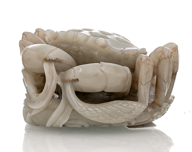 <b>A FINE CARVED LIGHT GREEN AND RUSSET JADE CRAB ABOVE WAVES</b>