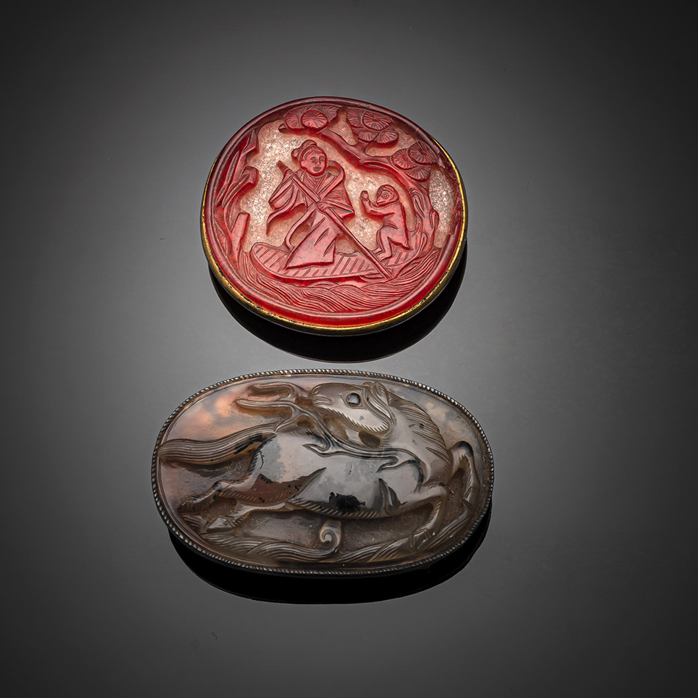<b>TWO RARE BELT BUCKLES, ONE WITH A RARE BEIJING GLASS INLAY AND THE SECOND WITH A CARVED HORSE AGATE PANEL</b>