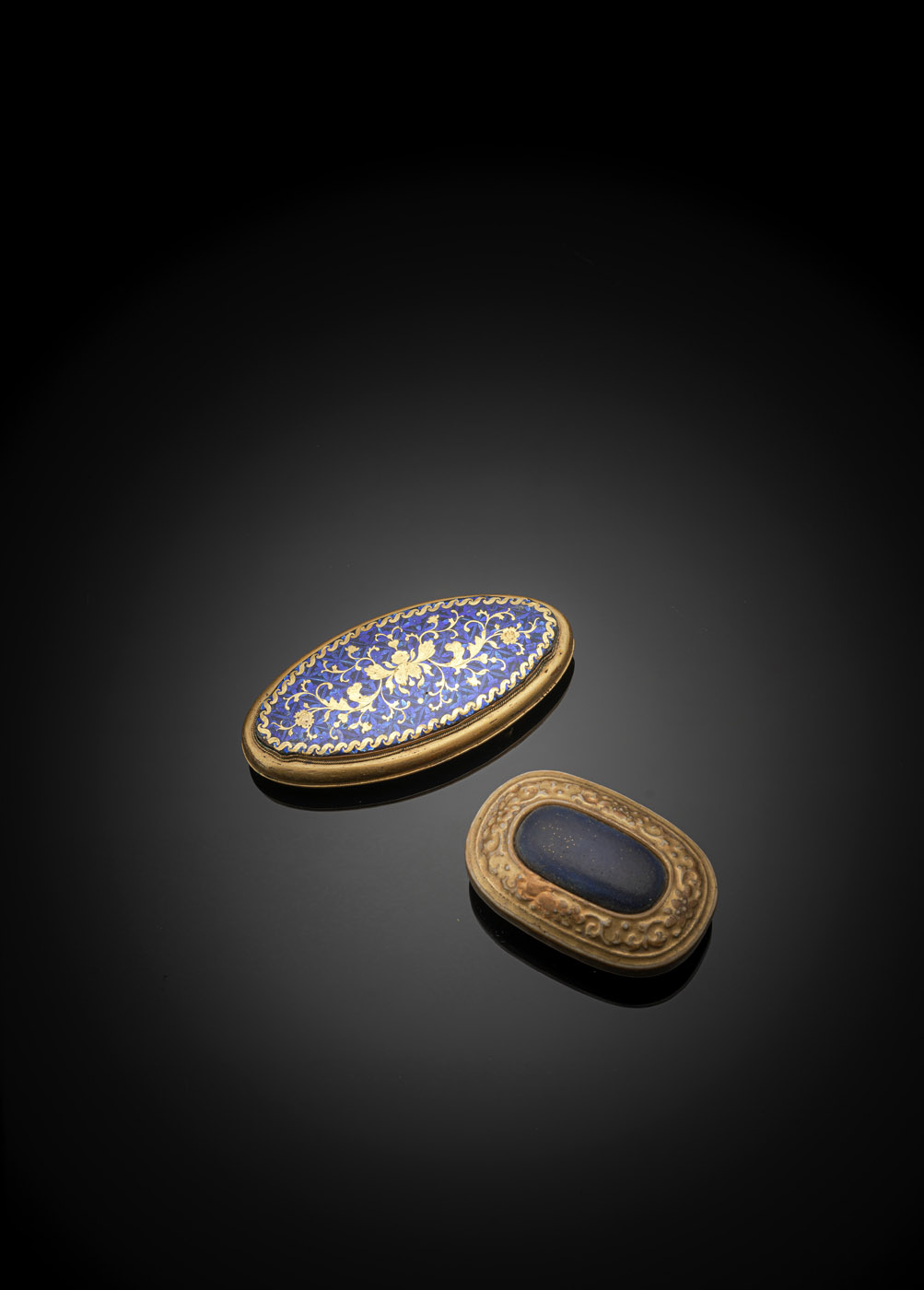 <b>TWO BELT BUCKLES: BRONZE AND ENAMEL AND PORCELAIN IMITATING METAL</b>