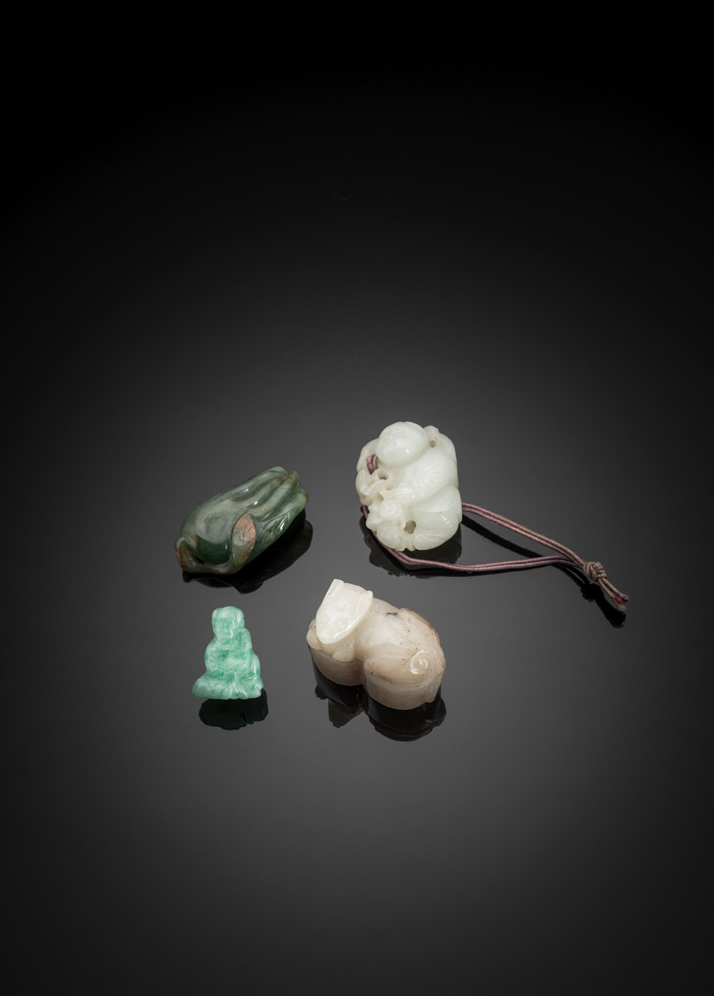 <b>A GROUP OF FOUR JADE CARVINGS WITH A FINGER CITRON, A BOY WITH COINS, A SMALL JADEITE PENDANT AND A SEAL</b>