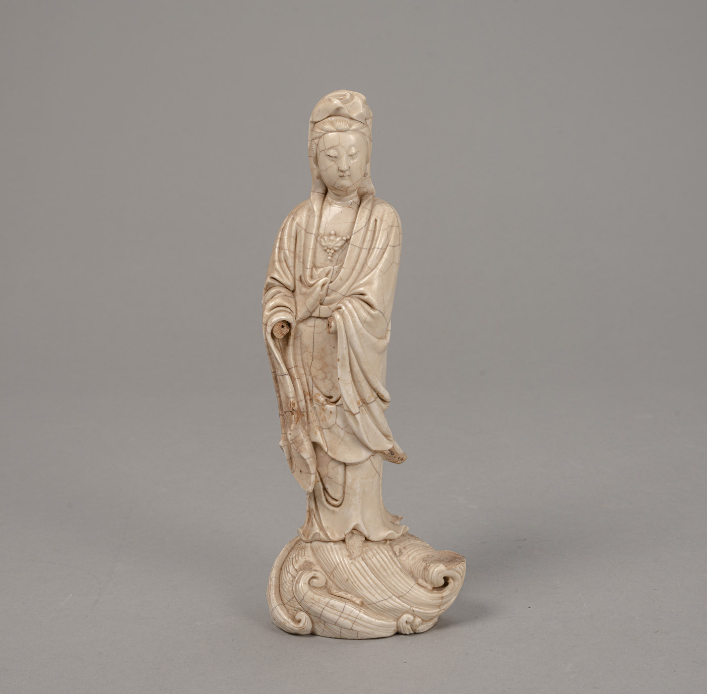 <b>A 'ZHANGZHOU' PORCELAIN FIGURE OF GUANYIN STANDING ON WAVES</b>