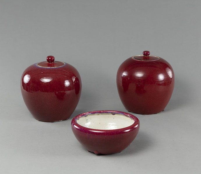 <b>TWO OXBLOOD-GLAZED GINGER JARS AND A BRUSH WASHER</b>