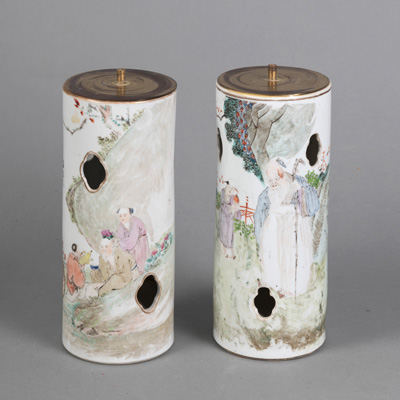 <b>TWO CYLINDRICAL PORCELAIN HAT STANDS WITH FOUR-PASS OPENINGS AND 'FAMILLE ROSE' FIGURE DECORATION</b>