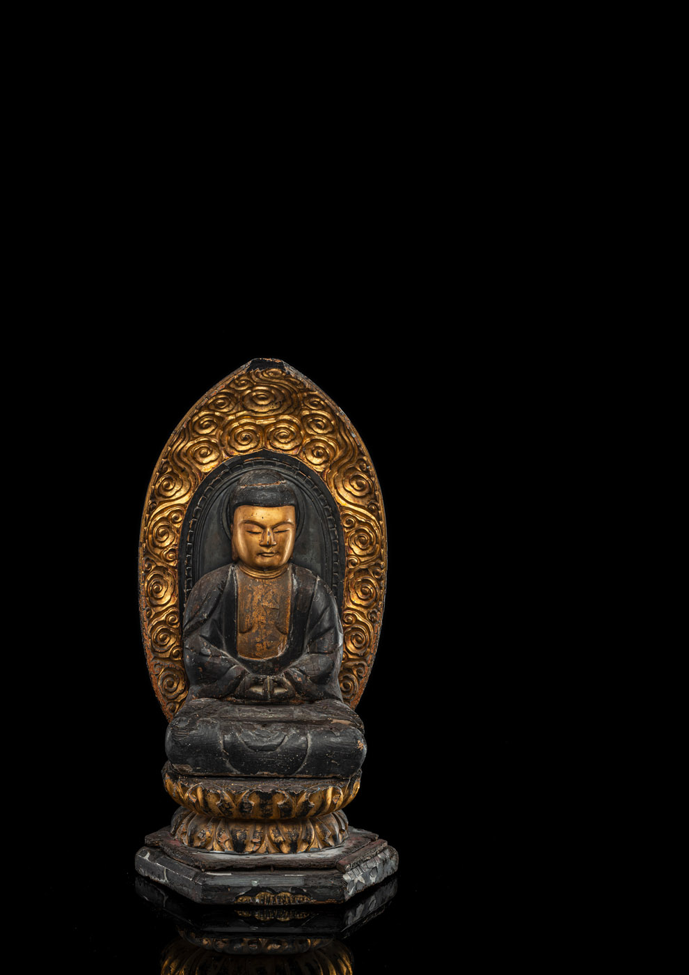 <b>A PART-GILT CARVED WOODEN FIGURE OF SEATED BUDDHA</b>
