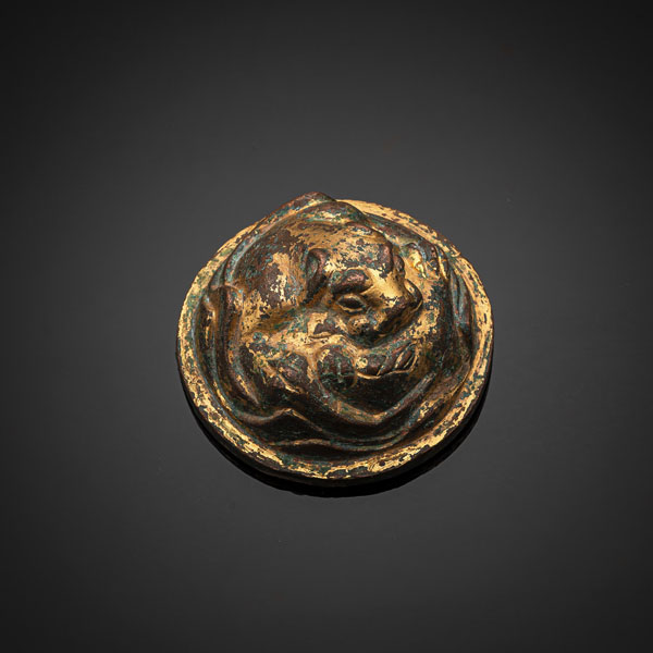 <b>A GILT-BRONZE WEIGHT IN SHAPE OF A TIGER, PARTLY GREEN CORRODED</b>