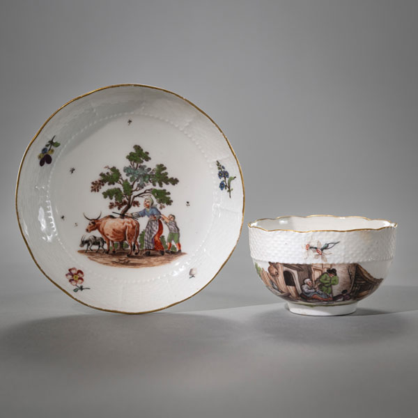 <b>A MEISSEN CUP AND SAUCER WITH RURAL SCENES</b>