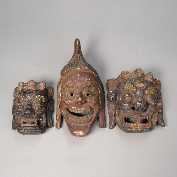 <b>THREE POLYCHROME PAINTED WOOD MASKS WITH FIERCE EXPRESSIONS</b>