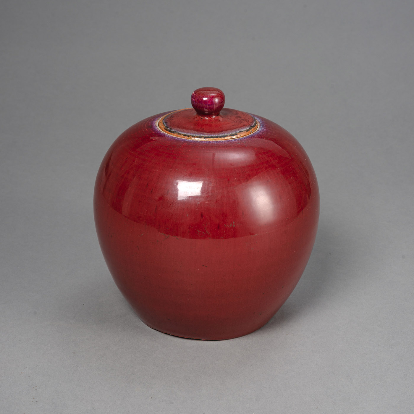 <b>A COPPER-RED GLAZED GINGER JAR AND COVER</b>