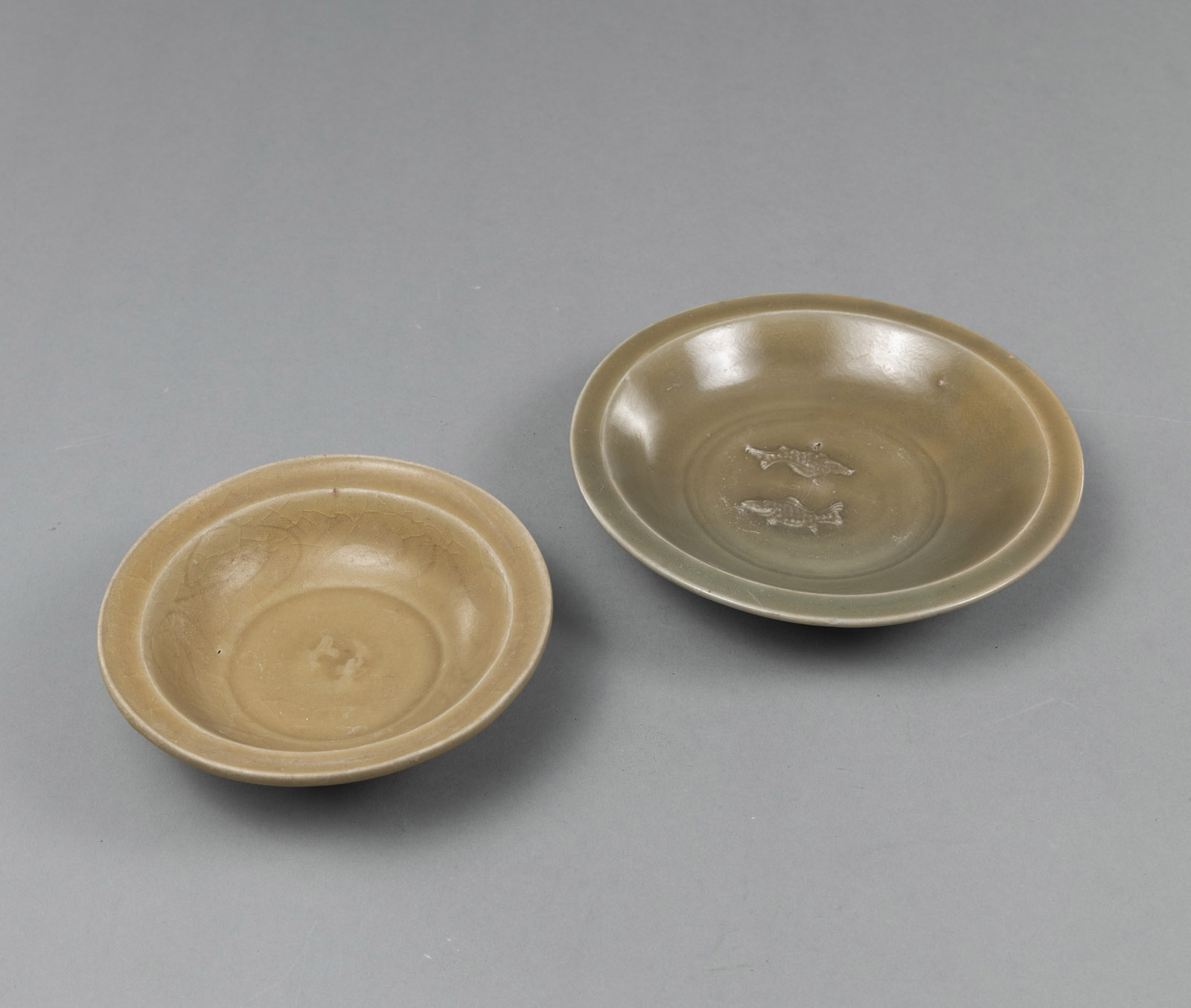 <b>TWO LONGQUAN TWIN-FISH DISHES COVERED WITH PARTIALLY CRACKLED CELADON GLAZE</b>