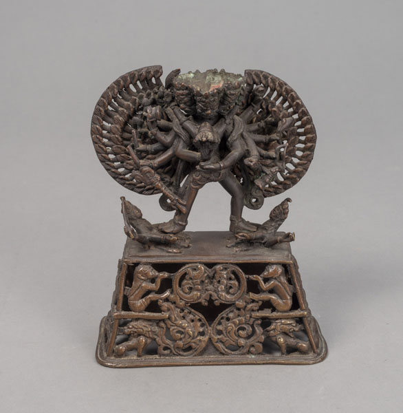 <b>A BRONZE FIGURE OF A TANTRIC DEITY IN YAB-YUM ON AN OPENWORK PEDESTAL</b>