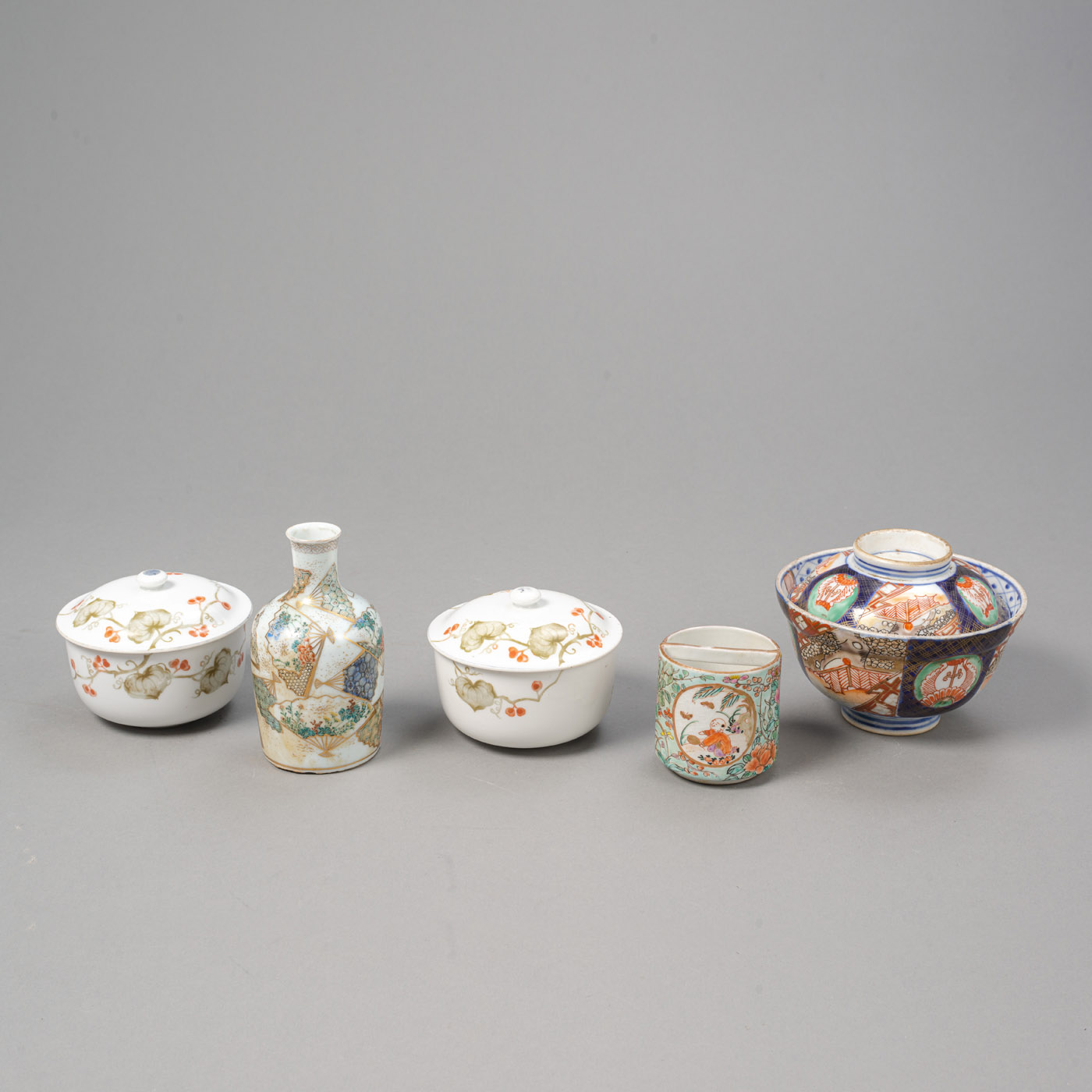 <b>AN IMARI-PORCELAIN LIDDED BOWL, A SMALL SAKE BOTTLE, AND TWO BOXES AND COVERS</b>