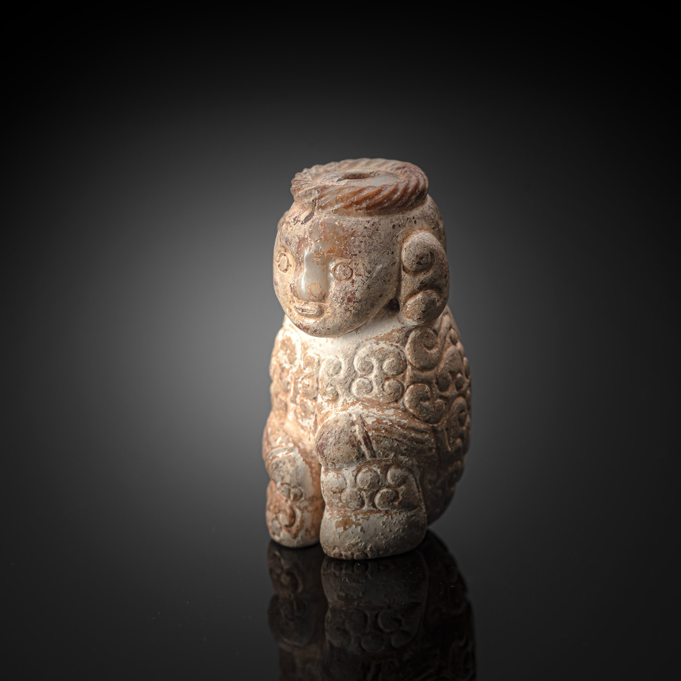 <b>A FINE AND RARE CALCIFIED JADE FIGURE OF A SEATED MAN</b>