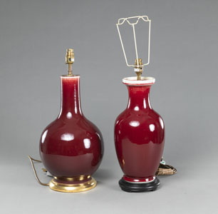 <b>TWO OXBLOOD-GLAZED VASES MOUNTED AS LAMPS</b>