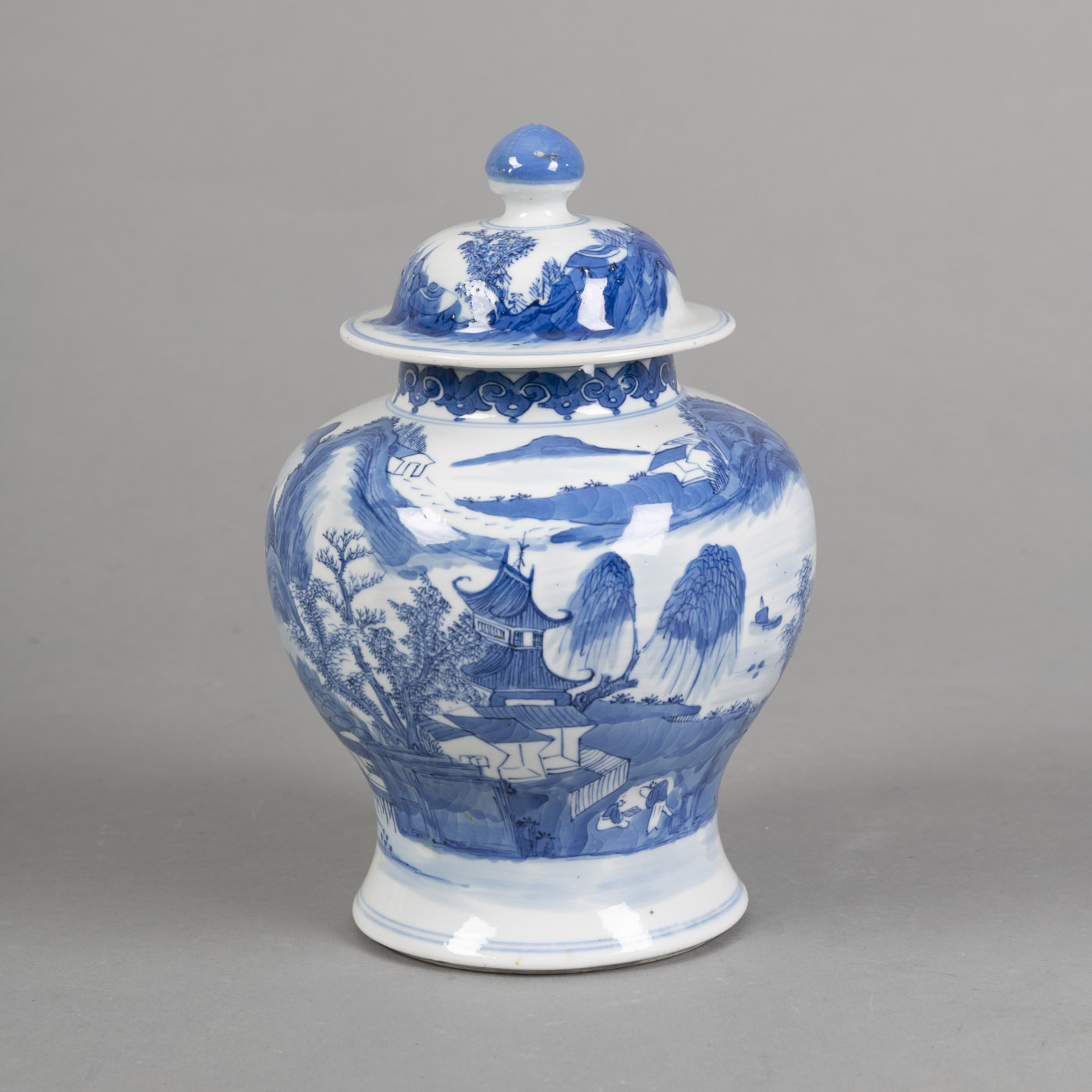 <b>A BLUE AND WHITE PORCELAIN VASE AND COVER DEPICTING A SEA LANDSCAPE</b>