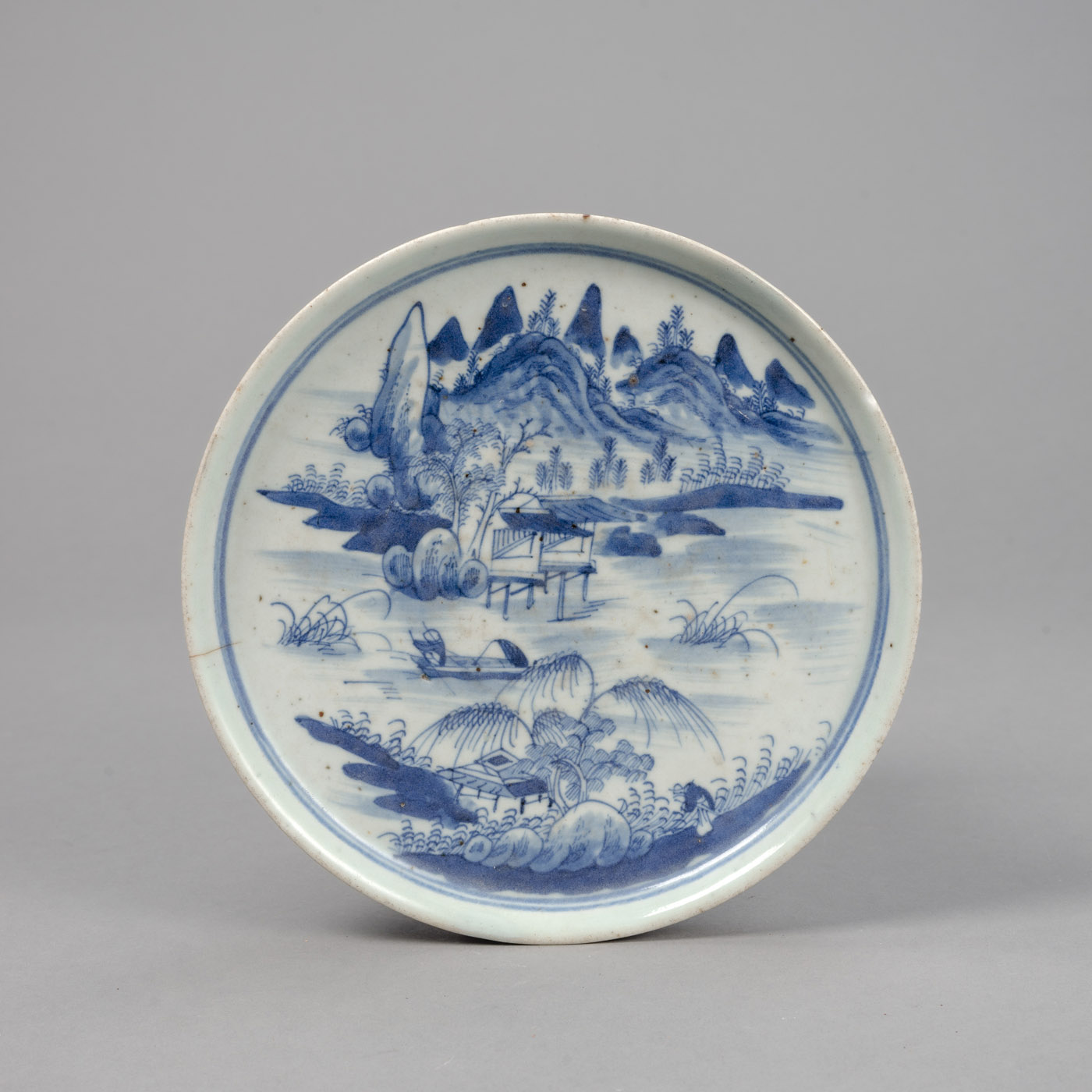 <b>A BLUE AND WHITE LANDSCAPE PORCELAIN DISH</b>