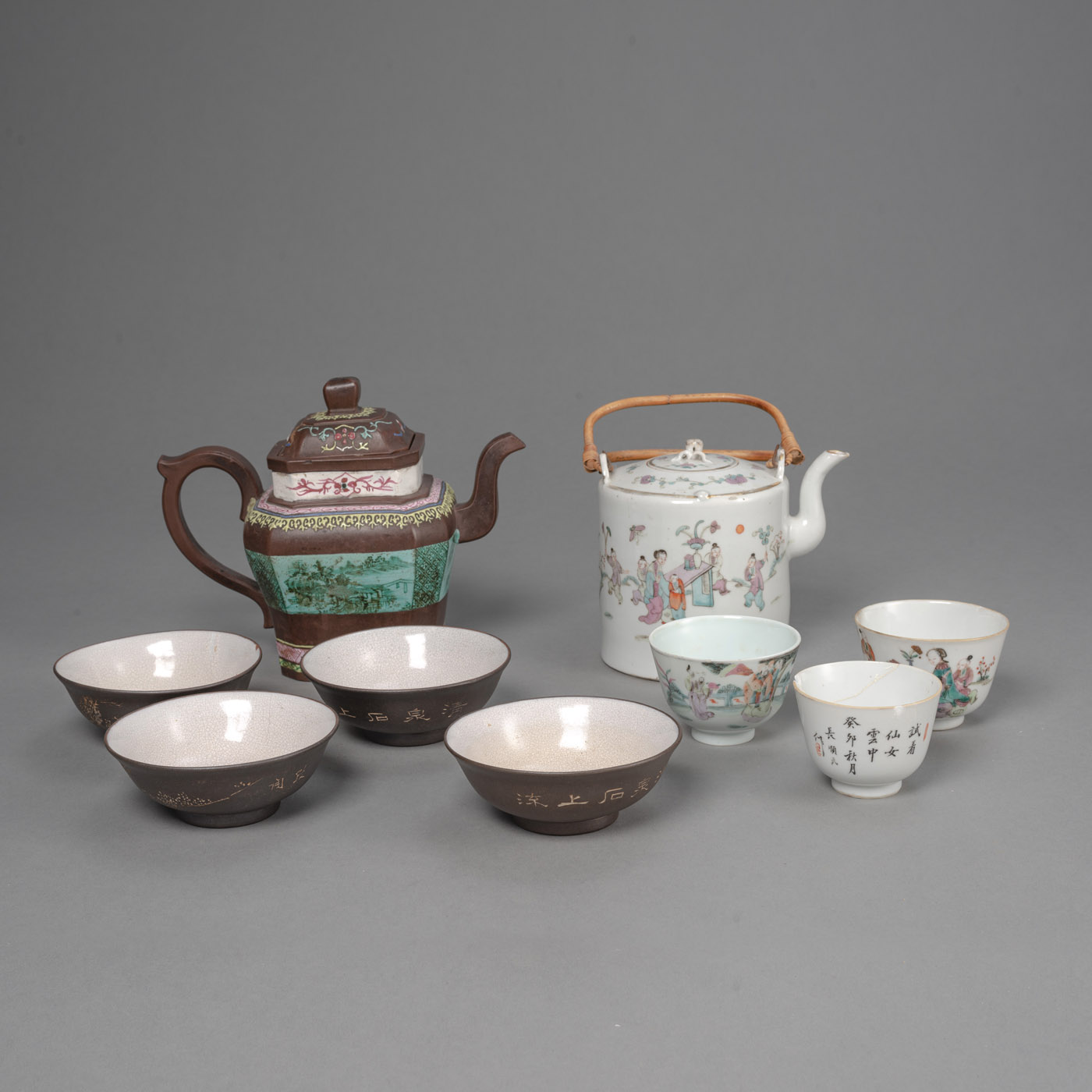 <b>A 'FAMILLE ROSE' PORCELAIN EWER AND THREE CUPS WITH A SET OF YIXING TEAPOT AND FOUR BOWLS</b>