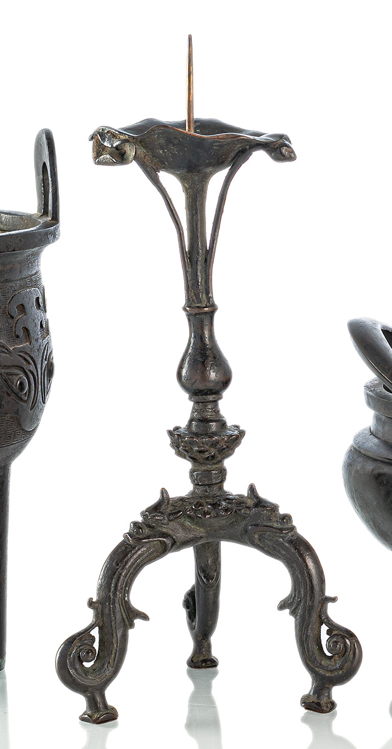 <b>A BRONZE CANDLE HOLDER</b>