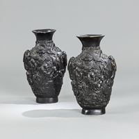 <b>A PAIR OF FIGURAL FAUX-BRONZE PORCELAIN VASES</b>