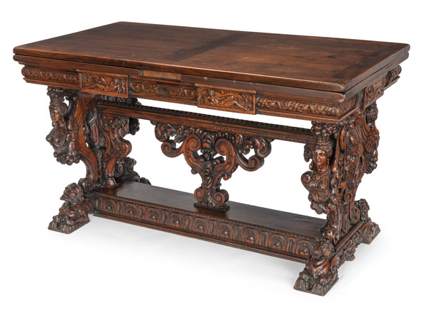 <b>A LARGE ITALIAN CARVED WALNUT RENAISSANCE STYLE EXTENDING TABLE</b>