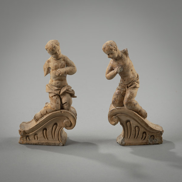 <b>A PAIR OF PUTTI ON VOLUTE SHAPED ARCHES</b>