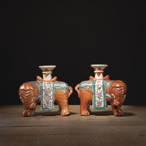 <b>A PAIR OF 'FAMILLE ROSE' PORCELAIN ELEPHANT CANDLESTICKS</b>