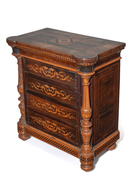 <b>A DECORATIVE FLORAL AND DICE PATTERN MARQUETRIED KINGWOOD AND WALNUT MODEL COMMODE</b>