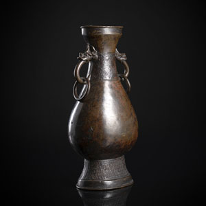 <b>A BRONZE VASE WITH  RING HANDLES</b>