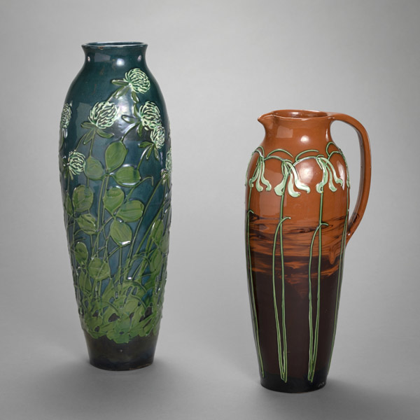 <b>A FLORAL TOOLED MAIOLICA VASE AND A JAR</b>