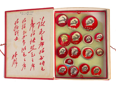 <b>A COLLECTION OF MAO PINS IN A RED BOX IN THE SHAPE OF A MAO BOOK WITH THREE INSERT TABLETS</b> <b>A COLLECTION OF MAO PINS IN A RED BOX IN THE SHAPE OF A MAO BOOK WITH THREE INSERT TABLETS</b>