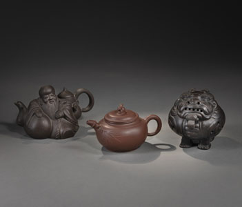 <b>THREE ZISHA OBJECTS: A TEAPOT WITH BAMBOO AND A RABBIT KNOB, A TEAPOT IN THE SHAPE OF A RECLINING SCHOLAR AND AN INCENSE BURNER IN THE SHAPE OF LUDUAN</b>