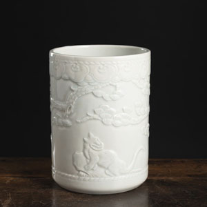 <b>A PORCELAIN BRUSHPOT WITH ANIMALS IN RELIEF</b>