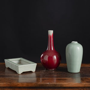 <b>A SMALL COPPER-RED BOTTLE VASE, A CELADON VASE, AND A CELADON JARDINIÈRE</b>
