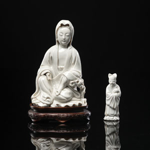 <b>A DEGUA FIGURE OF SEATED GUANYIN AND A FIGURE OF A STANDING OFFICIAL</b>