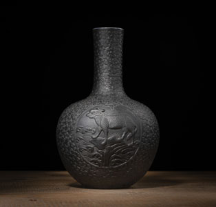 <b>A 'FAUX-BRONZE' PORCELAIN BOTTLE VASE WITH 'QILIN' IN RELIEF</b>