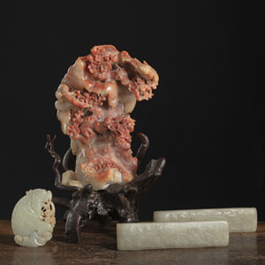 <b>THREE JADE PAPER WEIGHTS AND A SOAPSTONE 'BIRDS ON BRANCHES' RELIEF VASE</b>