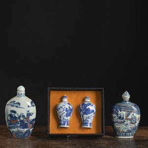 <b>TWO LARGE BLUE AND RED PORCELAIN SNUFFBOTTLES AND A PAIR OF FLORAL SNUFFBOTTLES</b>