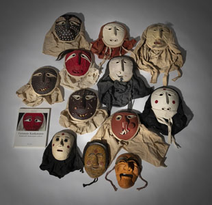<b>A GROUP OF TWELVE TRADITIOINAL MASKS AND THE BOOK 