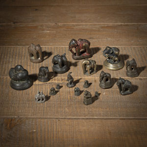 <b>A GROUP OF OPIUM WEIGHTS IN THE SHAPE OF ELEPHANTS, AN OX, AND A MONKEY</b>