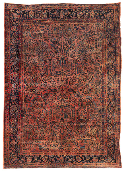<b>A reimport Sarouk carpet with salmon color background and floral ornamentation.</b>