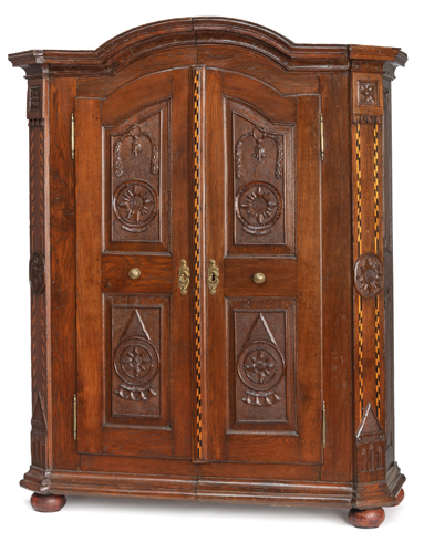 <b>A NEOCLASSICAL BRASS MOUNTED CARVED OAKWOOD FRUITWOOD AND BOG OAK CUPBOARD</b>