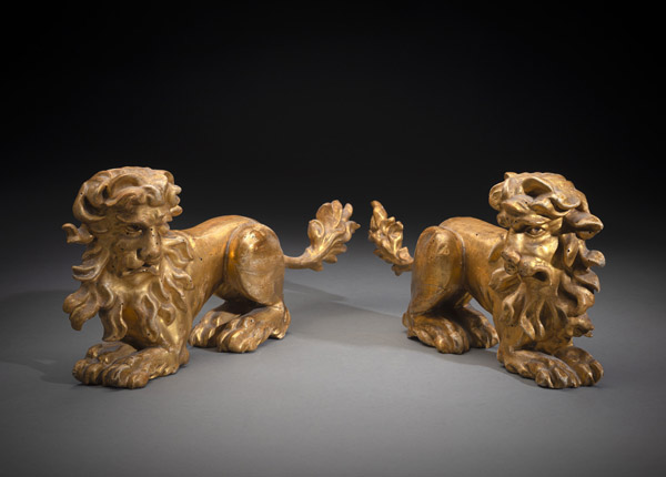 <b>A PAIR OF RELIEF CARVED LION FIGURES</b>