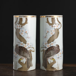 <b>A PAIR OF CYLINDRICAL POLYCHROME BIRD OF PREY ON BRANCHES PORCELAIN VASES</b>