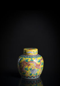 <b>A FINE PAINTED FAMILLE ROSE YELLOW-GROUND DRAGON JAR AND COVER</b>