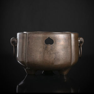 <b>A SILVER WIRE-INLAID BRONZE VESSEL WITH TWO ELEPHANT-HEAD SHAPED RING HANDLES</b>